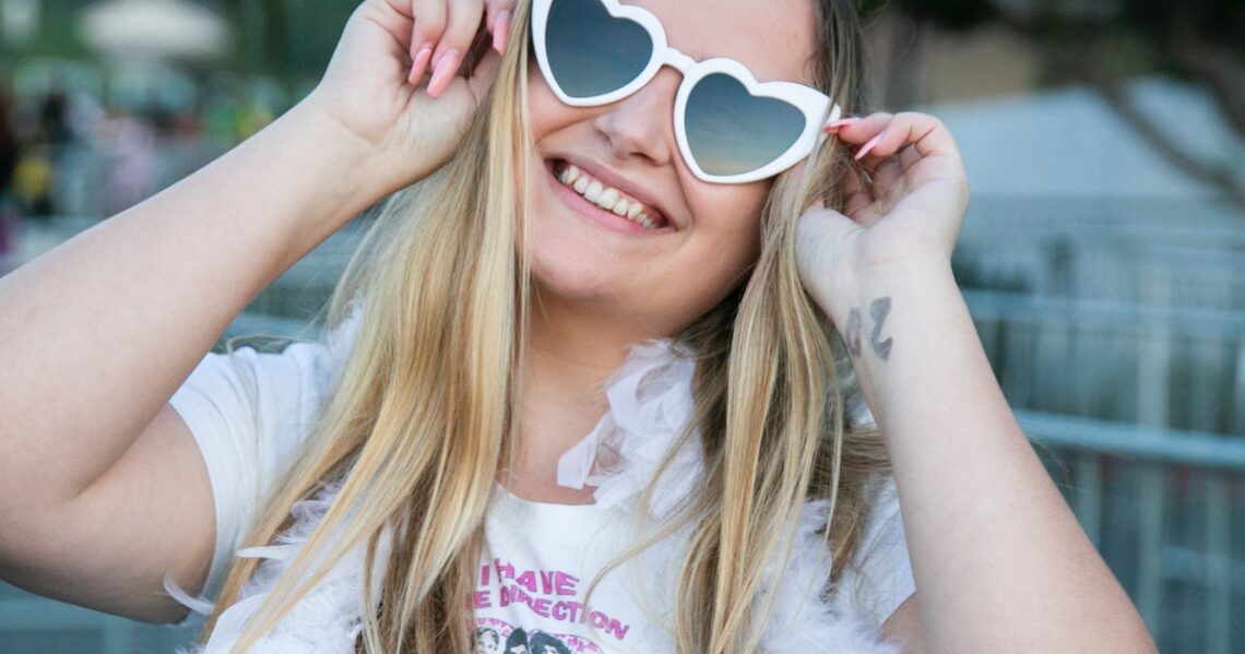 The Harry Styles ‘Love On Tour’ Outfits In L.A. Included Feather Boas, Cowboy Hats, & More