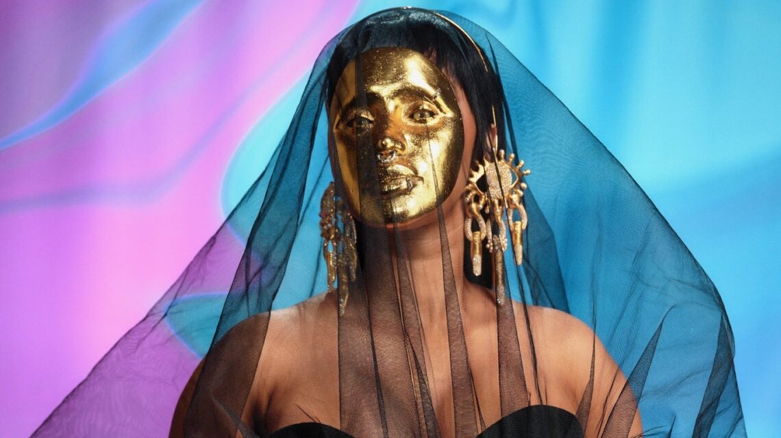 AMAs: Cardi B Arrives On The Red Carpet Wearing Gold Schiaparelli Mask