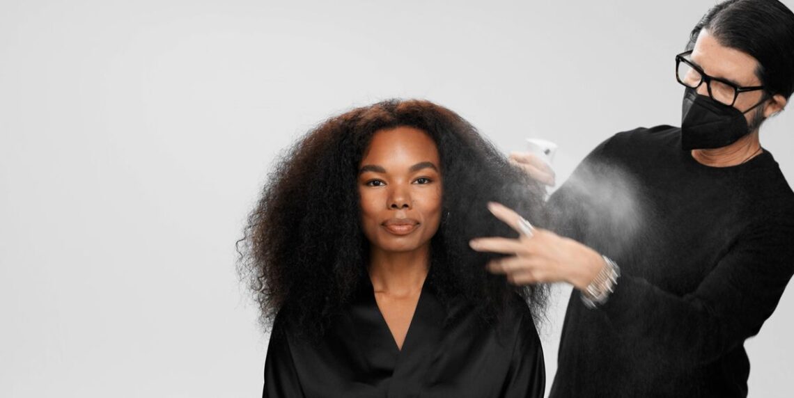 A Pro Stylist Creates A Chic Up-Do for Curly Hair