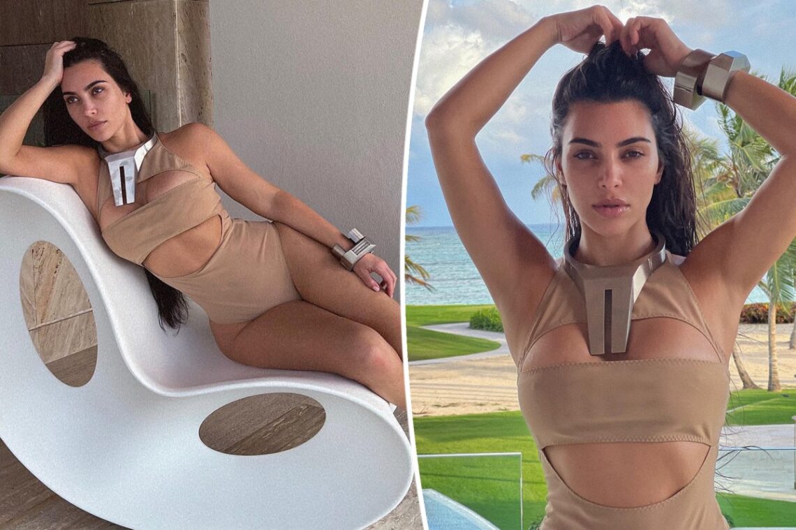 Kim Kardashian poses in nude swimsuit and supersized silver jewelry