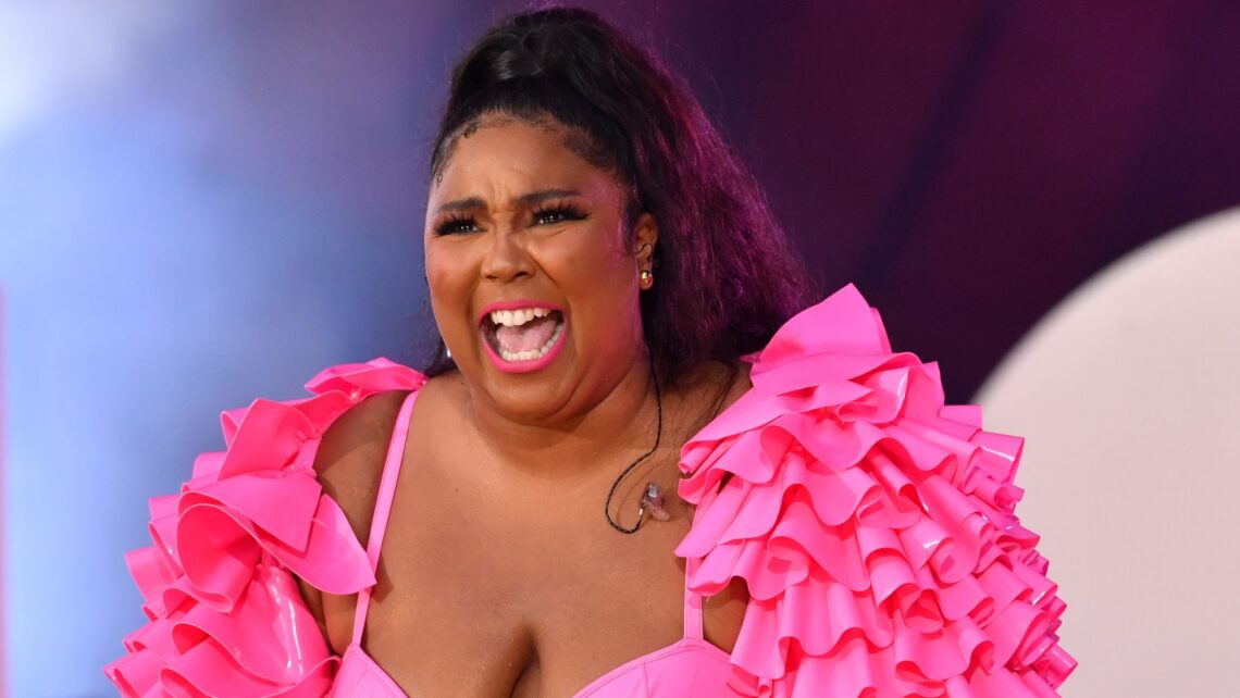 Lizzo Boards Plane Nearly Naked To Reveal Exciting News