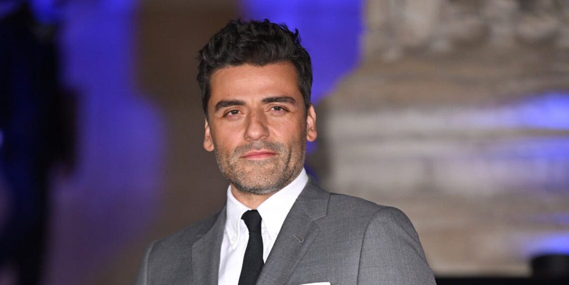 Oscar Isaac Wears a Thom Browne Skirt Suit for London Red Carpet