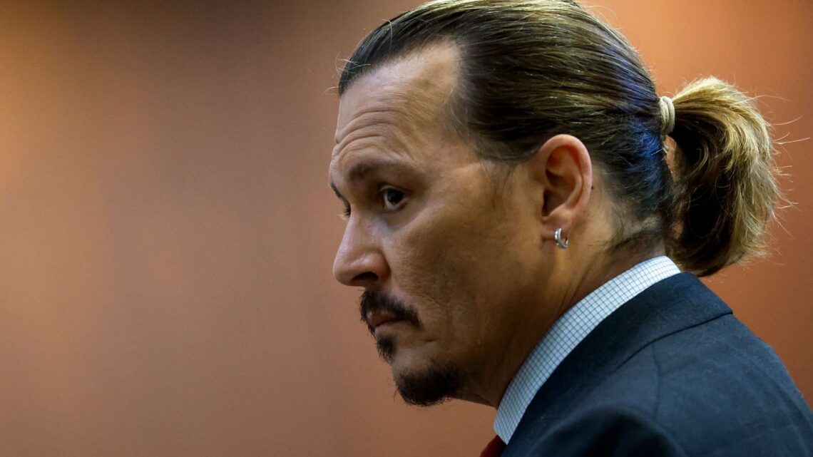 Johnny Depp Doodles And Shows Off His Work To His Approving Lawyer At Trial