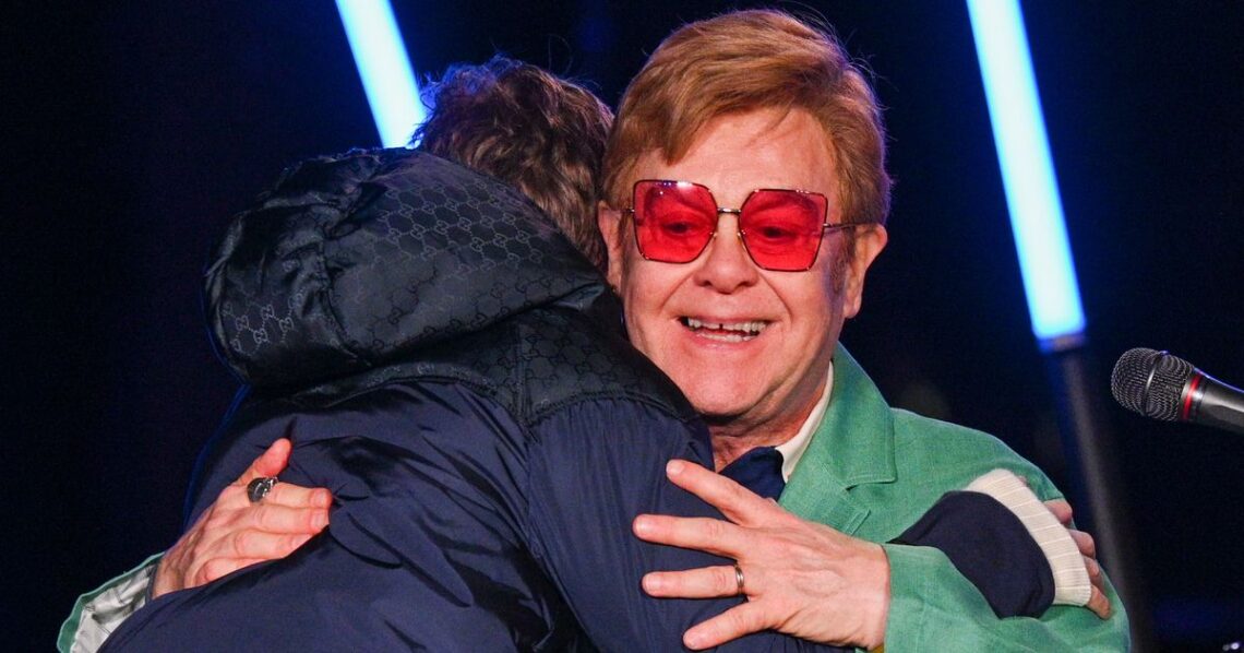 Elton John Lights Up NYC For The Holidays In Rare Appearance With His Kids