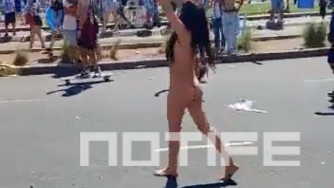 Watch as mystery brunette STRIPS NAKED to celebrate Argentina World Cup triumph in raucous Buenos Aires scenes